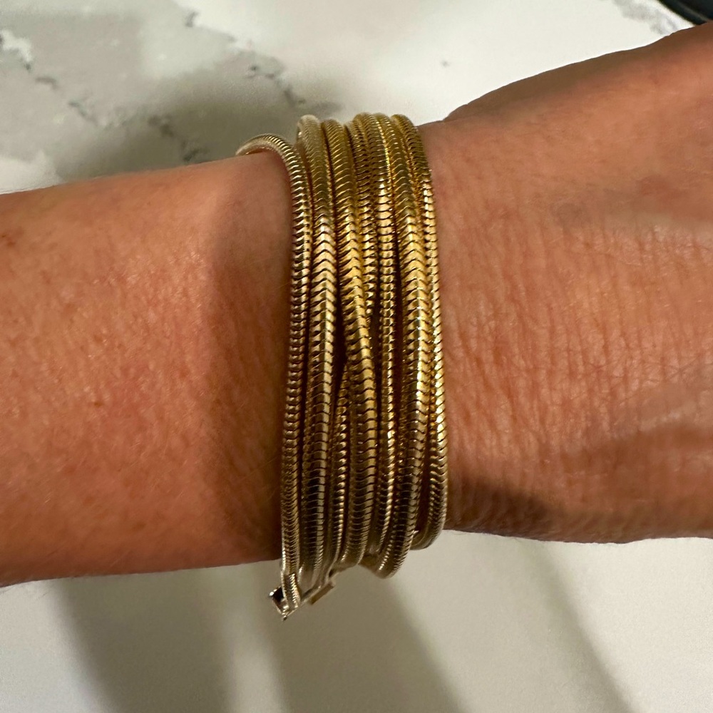 Gold bracelet separate chains that go together to look like a one piece item